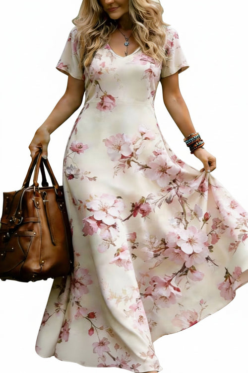 Full length shot of a loose fit short sleeve sunflower print long dress