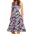 Lifestyle shot of a woman wearing a retro floral midi dress outdoors
